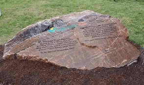 Photo of stone marker with engraved text